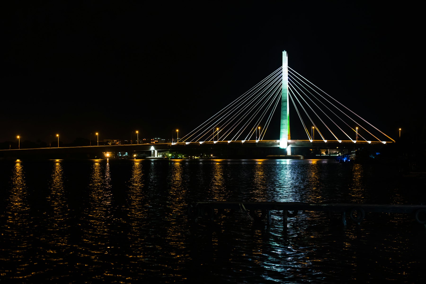 A long bridge over the water in Lagos at night